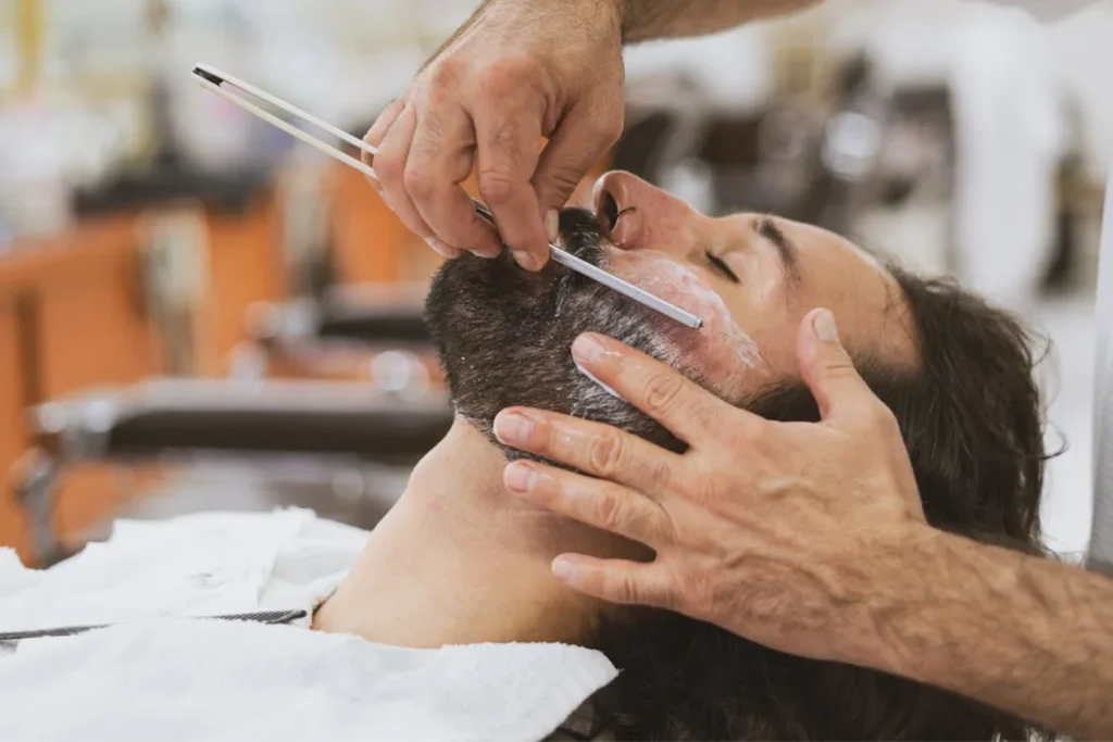 Men is shaving an other men