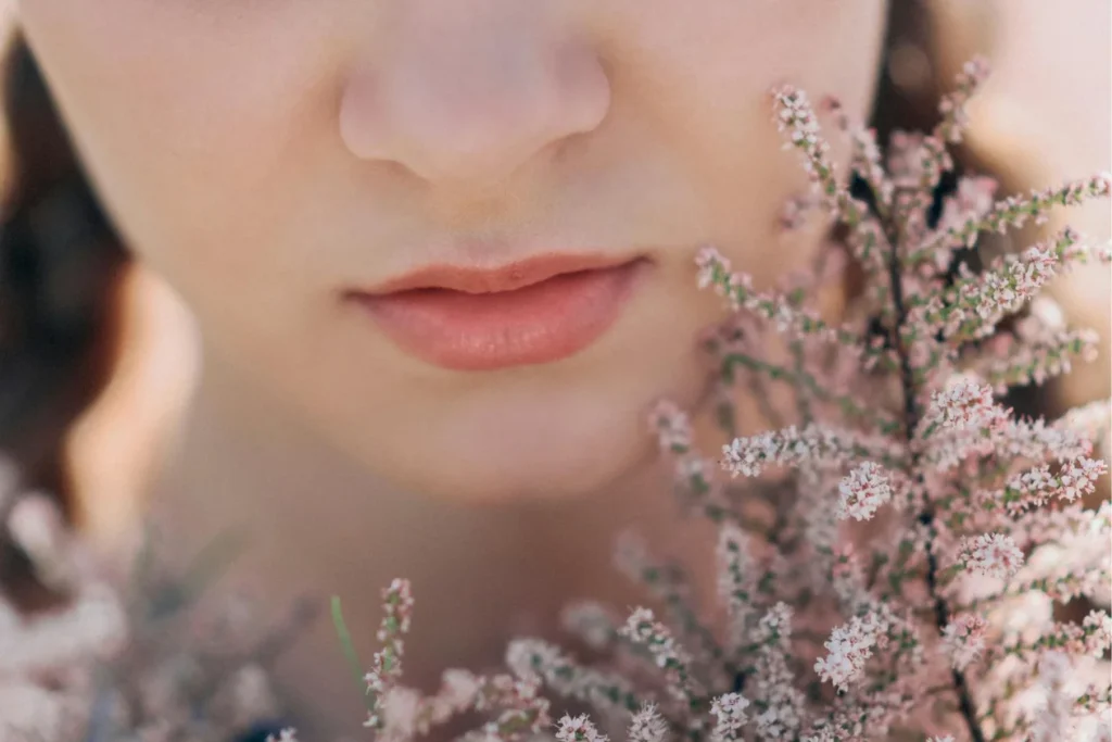 The lips of a woman with flowers