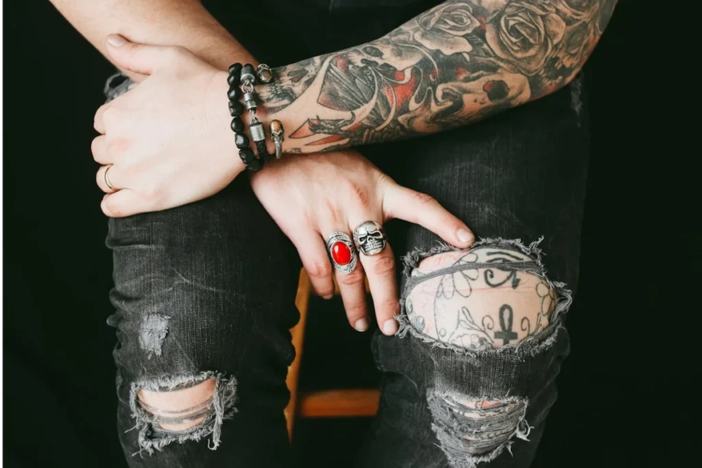Arms and legs of a tattooed man