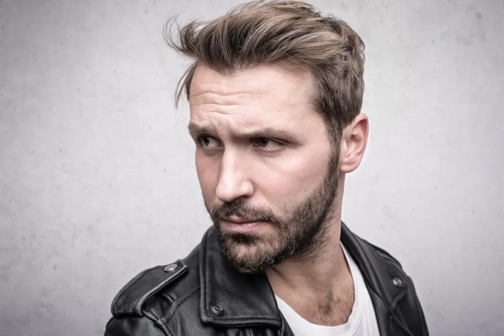 Man with a short beard and a leather jacket
