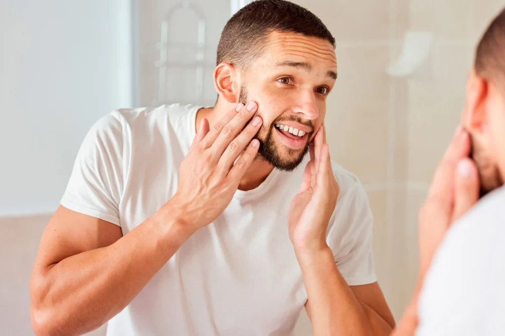 Young man preparing his skin for his beard care routine