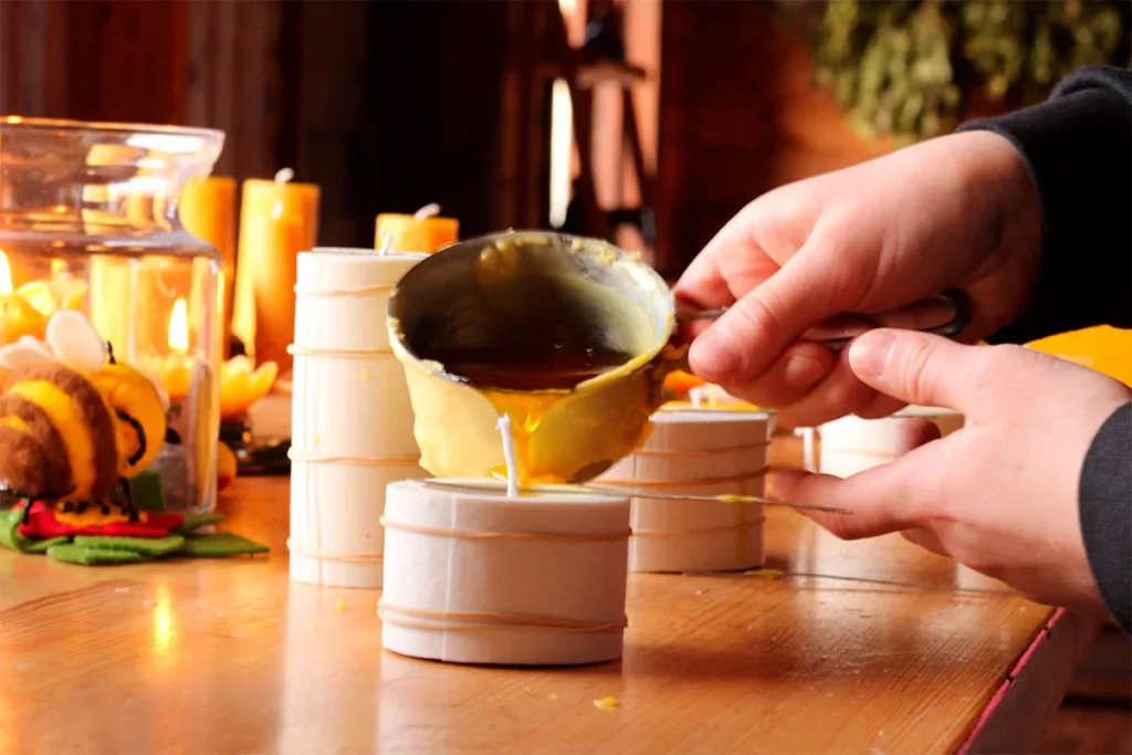 A person melting the beeswax